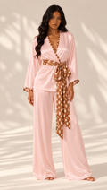 Dappled Grace blush pink silk pajama set by sleeps, with a wrap-style top, fawn-print belt and wide-leg trousers.
